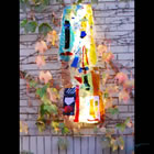 LIghted Fireplace Kiln-Fomred Glass Sculpture Lighted float-mounted kiln-formed glass sculpture on an outdoor fireplace