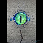 Kiln formed glass mask and metal garden sculpture titled "Moon Dancer"