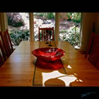 Red kiln formed glass bowl titled "Red Bowl"