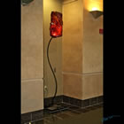 Red Spirit Lamp Kiln formed glass sculpture in the Harold Hamm Diabetes Center, titled "Red Spirit Lamp"