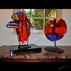 Two kiln formed glass scuptural masks.